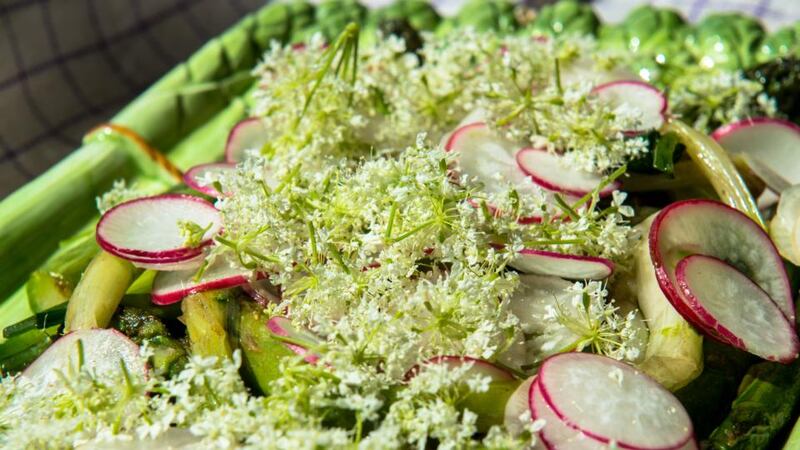 Viking feast: green asparagus served with radish and elderflowers. Photograph: Kasper Fogh