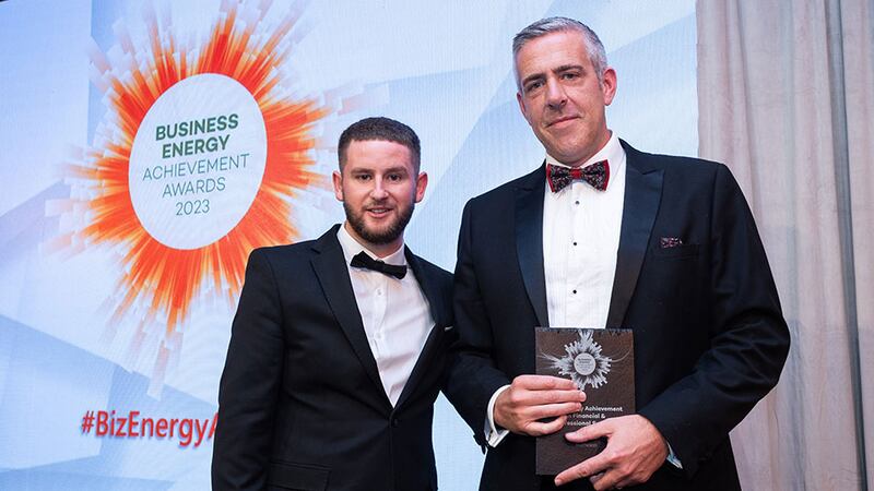 Adam Kane, senior sales executive at BusinessRiver, presents the best energy achievement in financial and professional services award to Garret Farrelly, Matheson