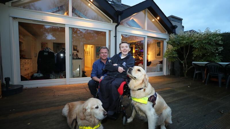 Tom Clonan with his son, Eoghan, and dogs Duke and Leahy. Photograph: Nick Bradshaw