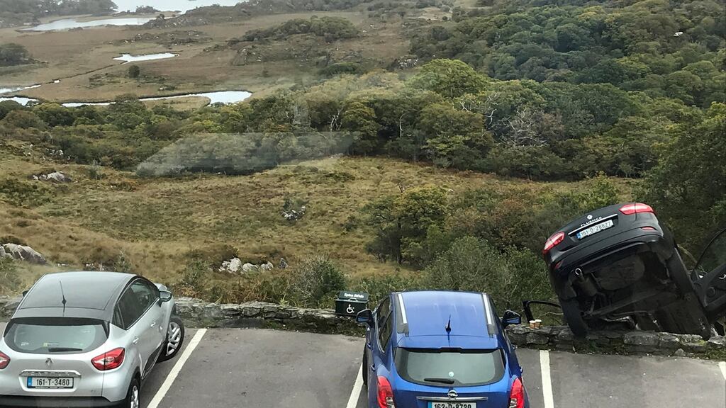 A car which had been driven by tourists was left dangling over the lakes of Killarney at lunchtime on Friday. Photograph: Raymond O’Shea