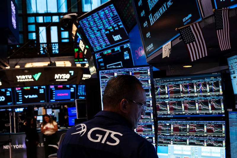 Global shares down as US government shutdown and AI anxieties take centre stage