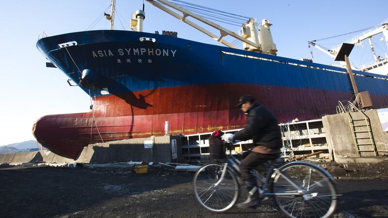 The Asia Symphony was carried right like a bath toy by the tsunami into the centre of the town . Photograph: Athit Perawongmetha/Getty Images)