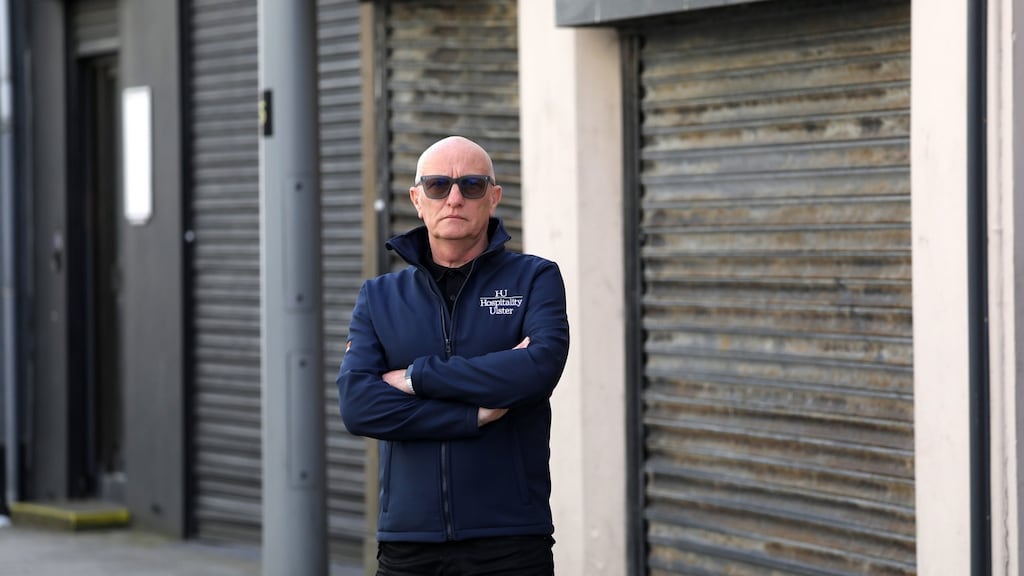 Colin Neill of Hospitality Ulster beside closed bars and restaurants in Larne, Co Antrim. Photograph: Peter Morrison/PA Wire