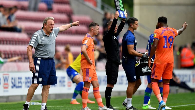 Cardiff City manager Neil Warnock speaks with Nathaniel Mendez-Laing during thier defeat at Wigan. Photo: Anthony Devlin/PA Wire.