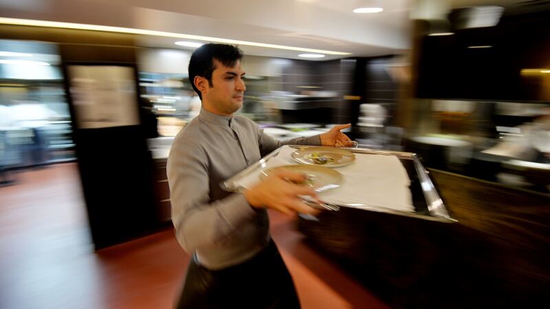20/01/2017 -- Staff carry the food from the kitchen to clients at Chapter One. Behind the scenes day in the life of Chapter One Michelin Star Restaurant. Photograph: Alan Betson / The Irish Times