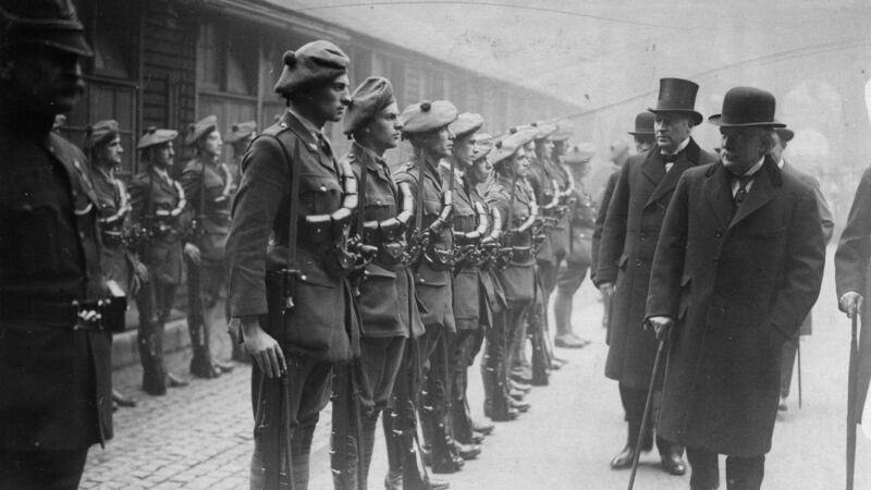 British prime minister David Lloyd George with his cabinet colleagues Andrew Bonar Law and Sir Hamar Greenwood inspecting officer cadets of the auxiliary division of the Royal Irish Constabulary in the quadrangle of the Foreign Office in London in 1921. Photograph: Hulton Archive/Getty Images