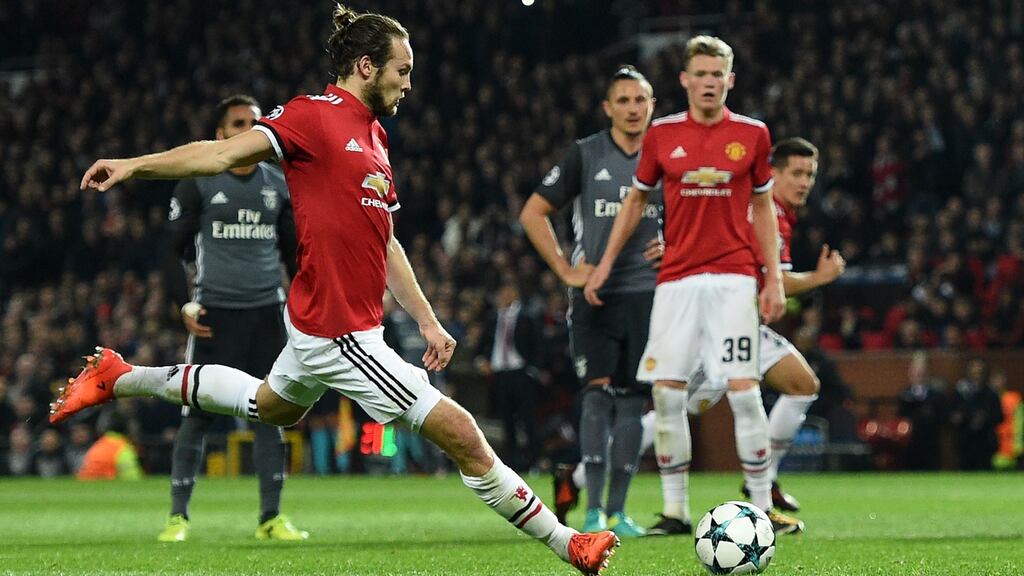 Manchester United’s Daley Blind scores their second goal against Benfica at Old Trafford. Photograph: Getty Images