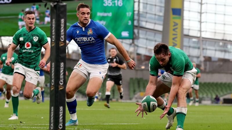 Hugo Keenan scores the second of his brace of tries on debut against Italy. Photograph: Dan Sheridan/Inpho