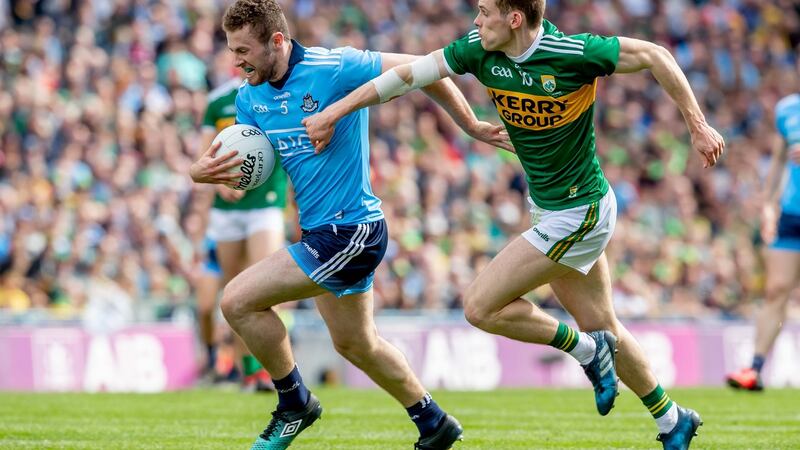 Gavin White tries to tackle Jack McCaffrey. Photograph: Morgan Treacy/Inpho