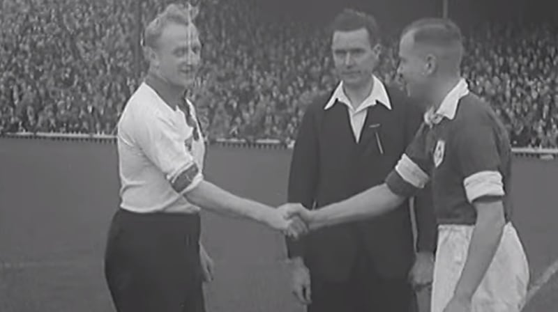 The Ireland captain and German captain shake hands before the match.