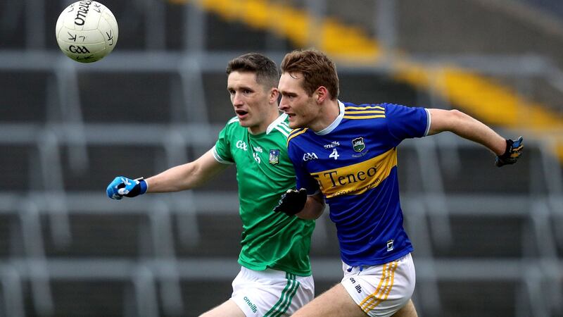 Colm O’Shaughnessy of Tipperary in action against Limerick’s Seán McSweeney during the Munster SFC semi-final at the LIT Gaelic Grounds in  Limerick. Photograph: Bryan Keane/Inpho
