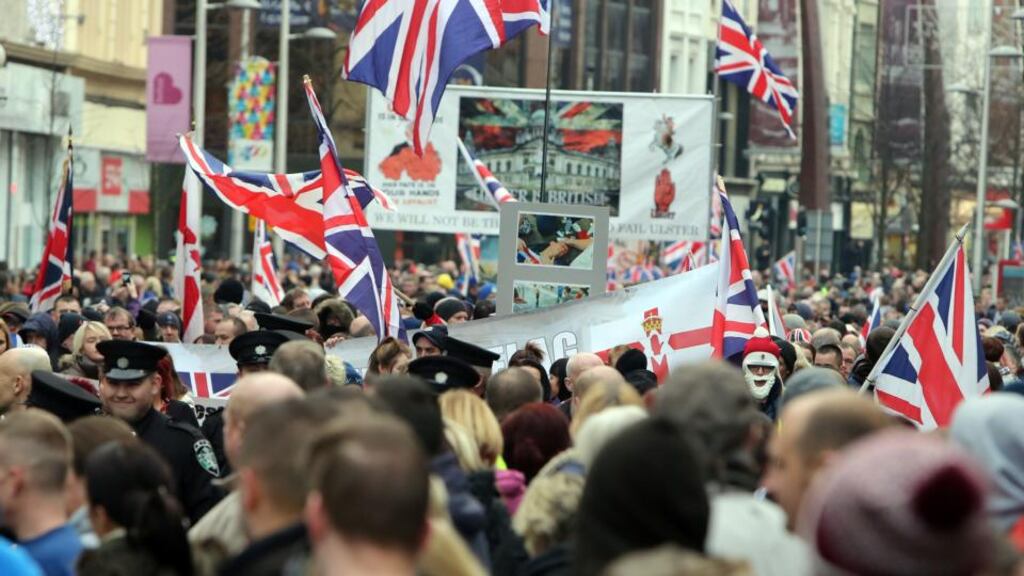 Loyalist flag protestors take part in a march from Belfast City Hall yesterday. Photograph: Paul Faith/PA Wire