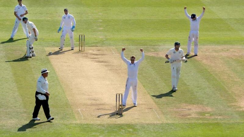 England’s Graeme Swann celebrates taking his fifth wicket, Australia’s Ryan Harris on day two of the second Ashes test. Photograph: Anthony Devlin/PA Wire.