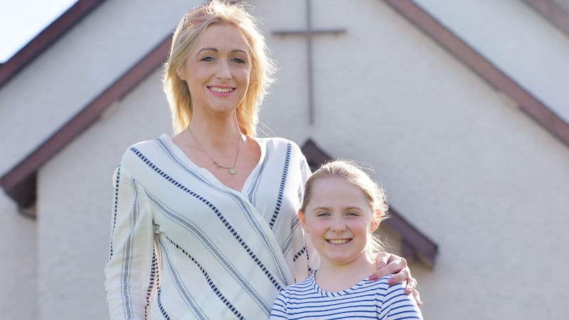 Bronwyn Cuddy with her daughter, Claudia, who will be making her communion this year at St Edmund’s Church, Castletown, Co Laois. Photograph: Alan Betson