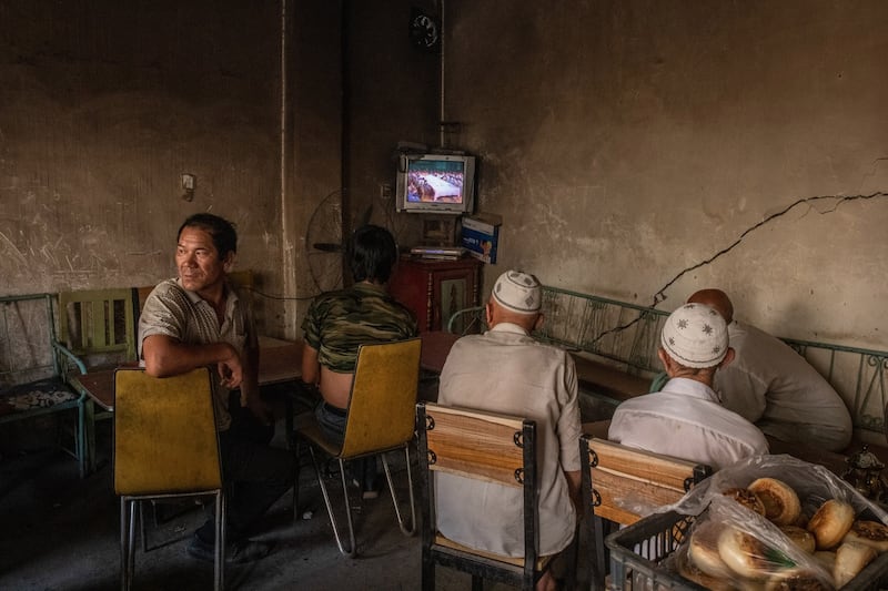 Uighurs watching a movie at a tea house in Xinjiang, China, on August 8th, 2019. Photograph: Gilles Sabrié/New York Times