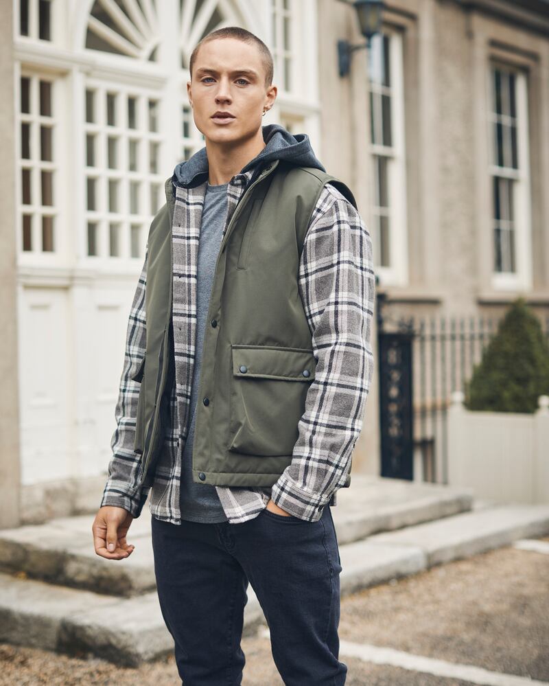 Khaki padded gilet €35, grey hooded overshirt €30, charcoal dipped hem tee €15 from Paul Galvin's latest collection Jack, available from Dunnes Stores