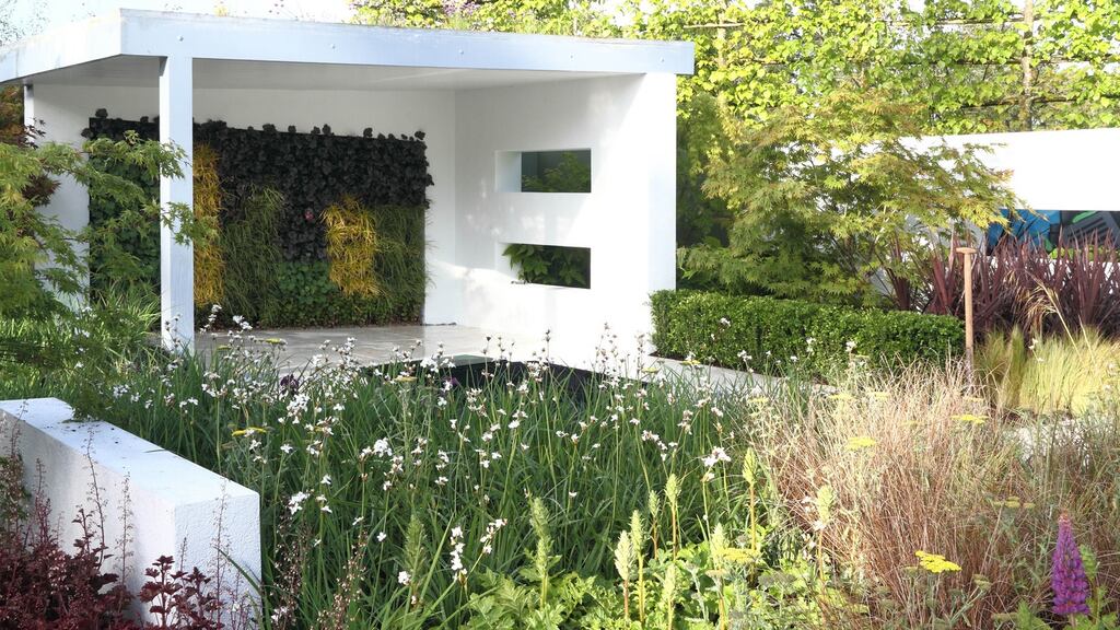 A carport surrounded by flowers, as seen at Bloom in 2014.