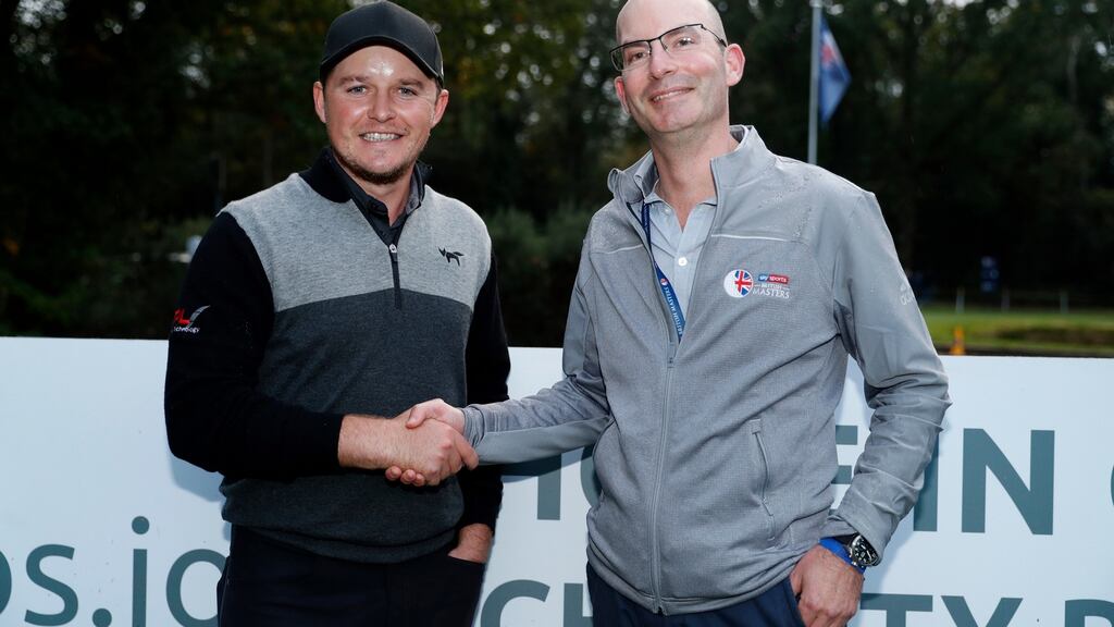 Eddie Pepperell poses for a photo after his hole-in-one during the opening round of the British Masters. Photograph: Luke Walker/Getty Images