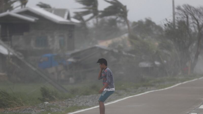 Strong winds batters a villager in the typhoon-hit town of Baggao, Cagayan province, Philippines. Photograph: EPA/FRANCIS R. MALASIG