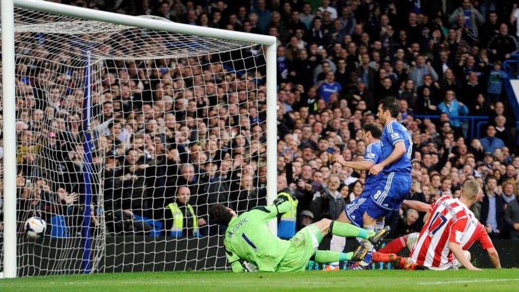 Frank Lampard scores Chelsea’s second goal against Stoke City. Photograph: EPA