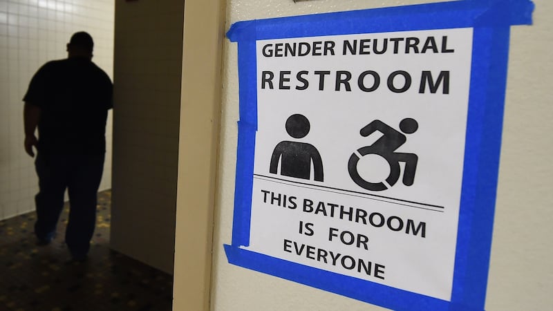 A sign posted outside of the gender-neutral toilets in LA's Santee High School. Photograph: Mark Ralston/AFP/Getty Images