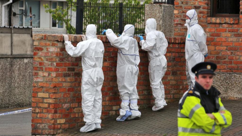 Gardai examine the scene of a shooting on St Dominick’s Road, Tallaght. Photograph: Colin Keegan, Collins Dublin.