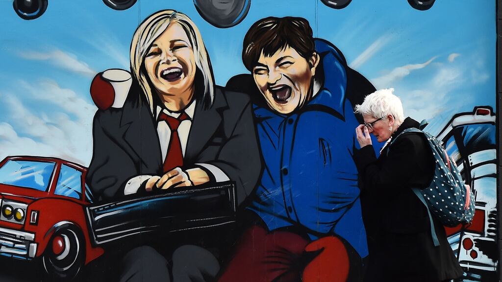 Belfast mural depicting Sinn Féin’s Michelle O’Neill (L) and the DUP’s Arlene Foster as the unlikely bedfellow characters from the movie Planes, Trains and Automobiles. Photograph: Charles McQuillan/Getty