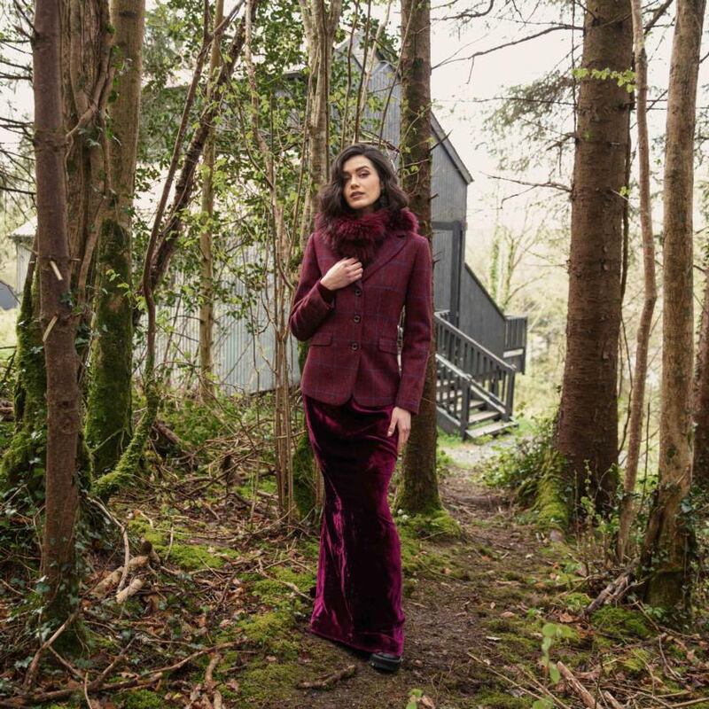 Check hacking jacket (€260), burgundy cable knit (€80), red velvet skirt POA