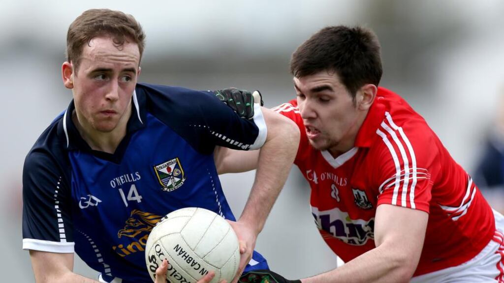 Cavan's Paul O'Connor is shadowed by Sean Kiely of Cork in Tullamore.  Photograph: James Crombie/Inpho