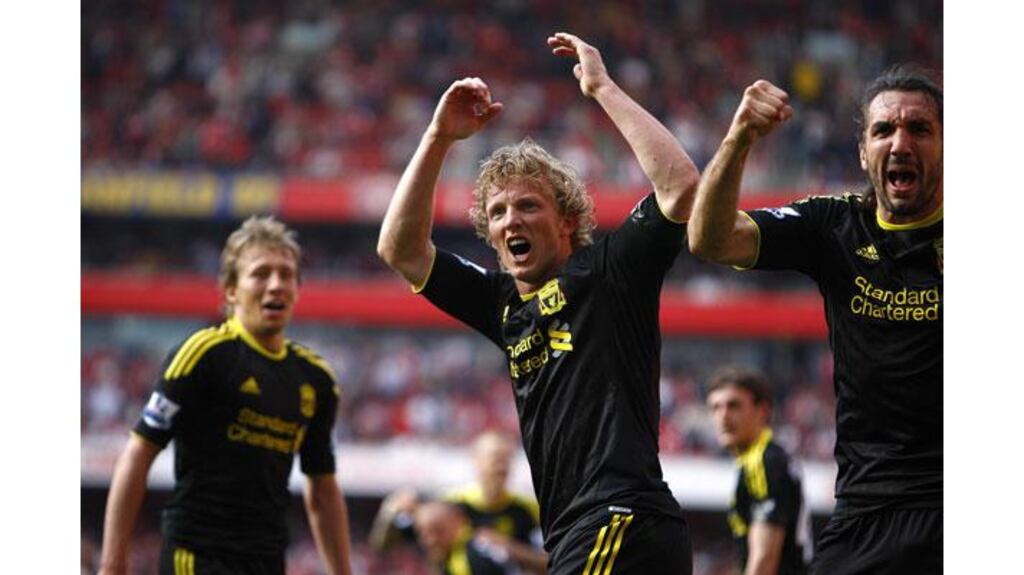 Liverpool's Dirk Kuyt (centre) celebrates after scoring the late equaliser to dent Arsenal's premier League title hopes at the Emirates Stadium. Photograph: Sean Dempsey/PA Wire