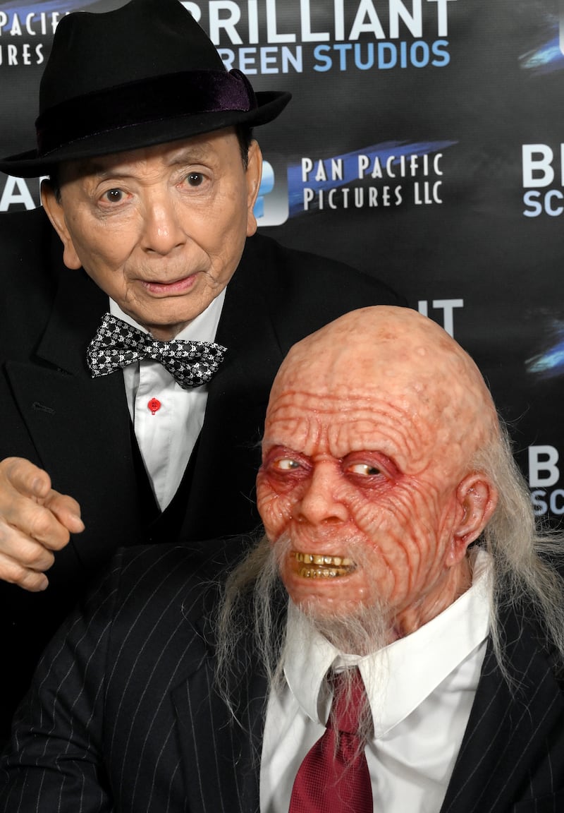 James Hong poses with his likeness from Big Trouble In Little China Lo Pan at a screening in Hollywood Of Patsy Lee and The Keepers Of The 5 Kingdoms in February, 2023. Photograph: Albert L. Ortega/Getty Images