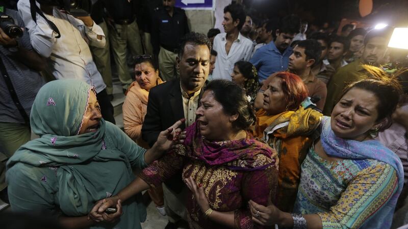 Relatives of the victims of a suicide bomb blast cry outside a hospital in Lahore, Pakistan, on Sunday. Photograph: Rahat Dar/EPA
