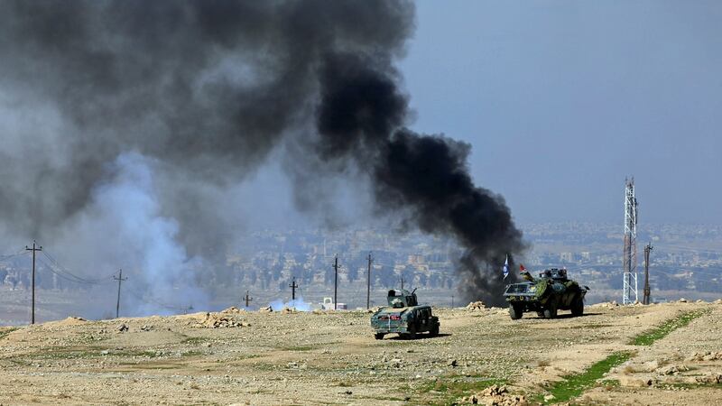 Smoke rises during a battle between Iraqi forces and Islamic State militants south of Mosul, Iraq. Photograph: Alaa Al-Marjani/Reuters