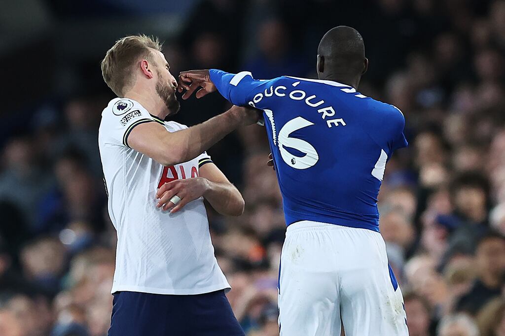 Tottenham's Harry Kane is pushed in the face by Everton's Abdoulaye Doucouré during their 1-1 draw at Goodison Park on Monday. Photograph: Alex Livesey/Getty Images