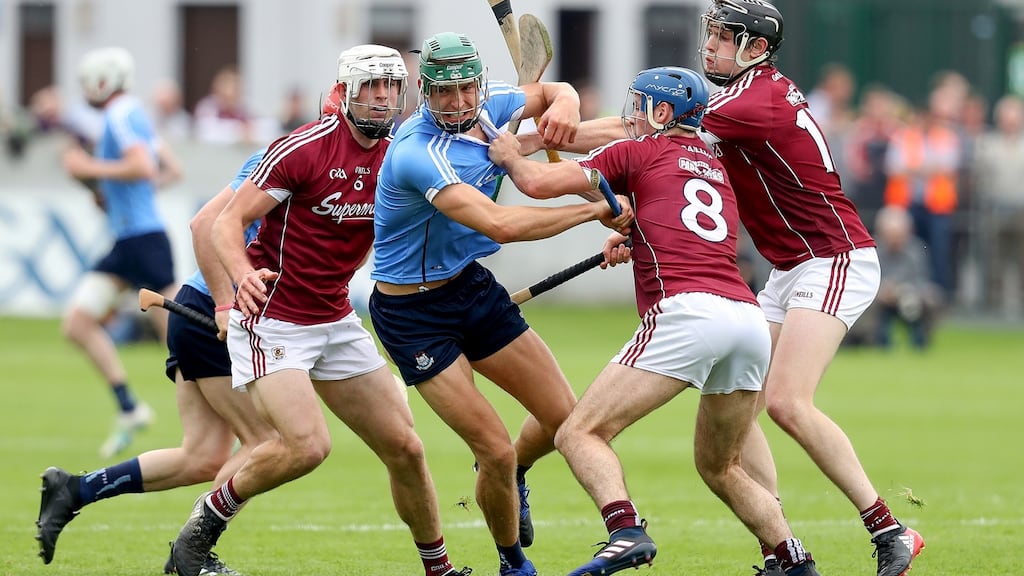 Dublin’s Chris Crummey with Gearóid McInerney, Johnny Coen and Joseph Cooney of Galway during the Leinster senior hurling championship quarter-final at O’Connor Park, Tullamore. Photograph: Tommy Dickson/Inpho
