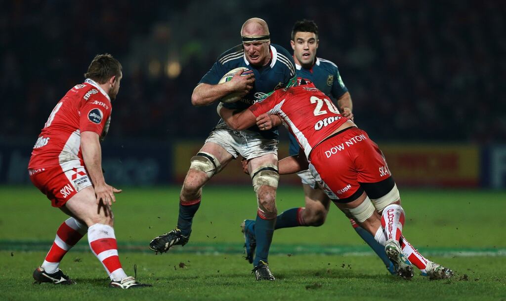 Munster’s Paul O’Connell is tackled by Gloucester’s Sione Kalamafoni during the Heineken Cup, Pool Six match at Kingsholm Stadium, Gloucester, on Saturday.