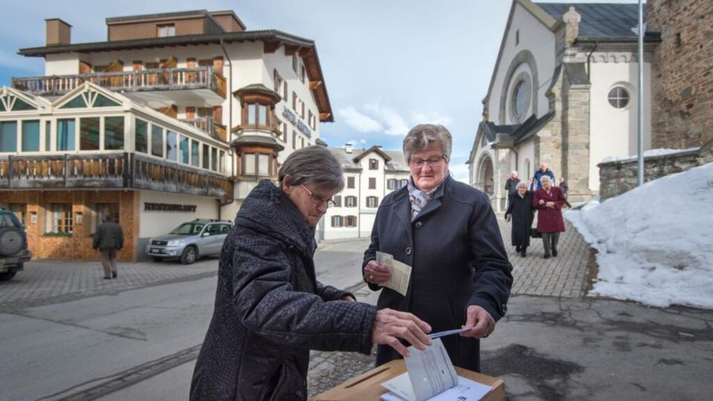 Swiss voters have their say on such issues as immigration and tax reform. Photograph: Benjamin Manser/Keystone/AP
