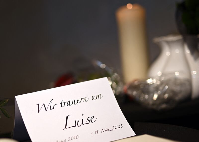 A book of condolences and a card reading "We mourn Luise" in a church in Freudenberg, western Germany. Police in the town say a girl, identified only as Luise, died last Saturday “as a result of numerous knife wounds and subsequent blood loss”. Photograph: Ina Fassbender/Getty Images