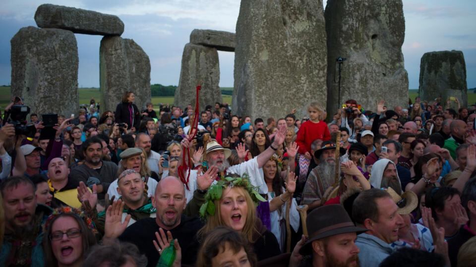 People take part in incantations during a sunset ceremony at the Stonehenge monument last night. Photograph: Kieran Doherty/Reuters