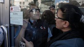 Cypriots queue calmly as banks reopen