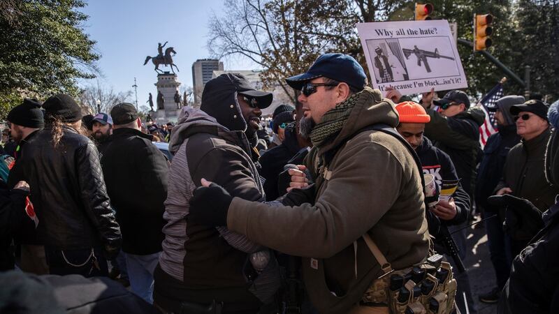 Gun rights advocates outside the secure perimeter of the Capitol in Richmond. Photograph: Victor J. Blue/New York Times