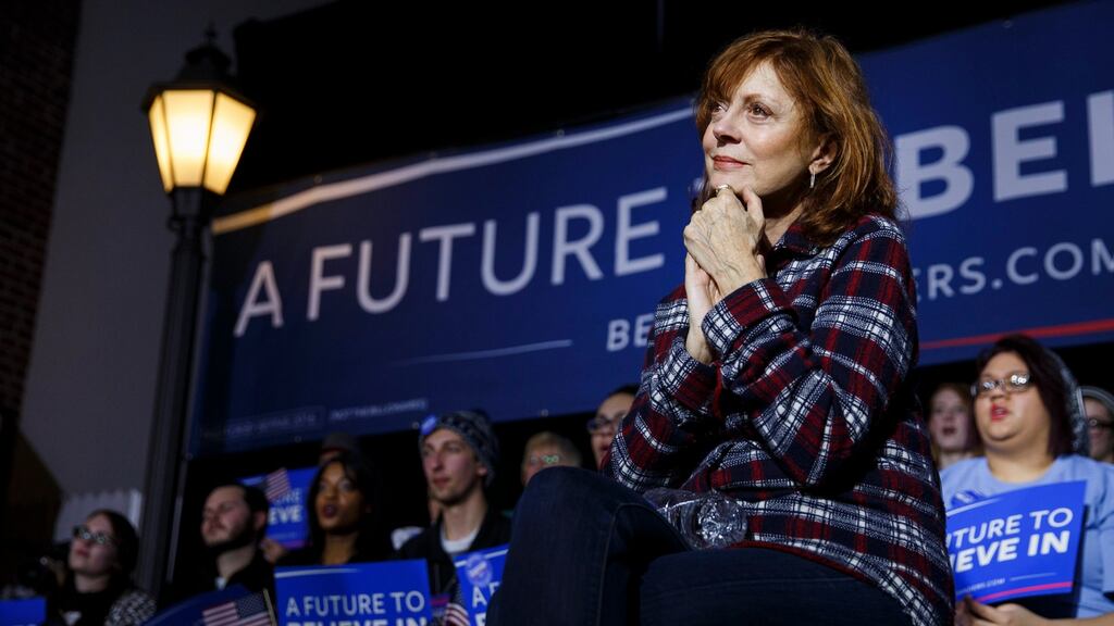 US actor Susan Sarandon listens as Democratic presidential candidate Bernie Sanders appears on stage during a campaign appearance in Mason City, Iowa. Photograph: Eugene Garcia/EPA