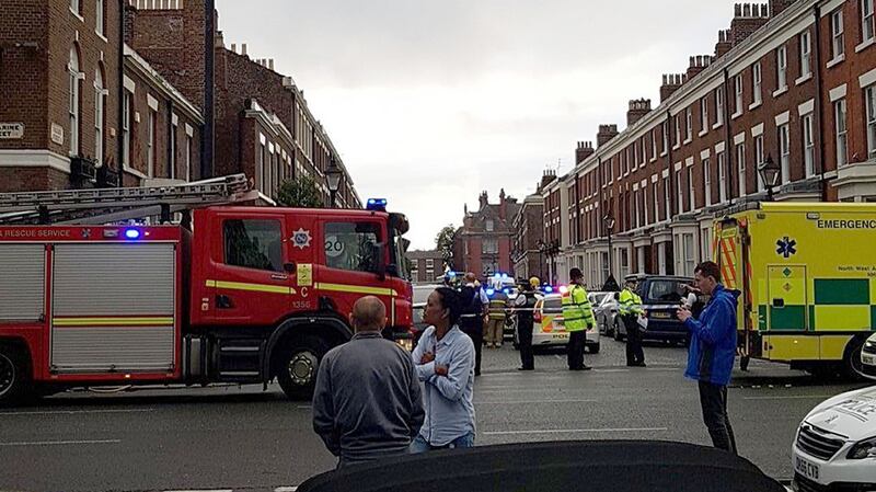 The scene in Falkner Street, Liverpool, where the bodies of a woman and two children were found on Tuesday evening. Photograph: @TristanBacon/Twitter/PA Wire