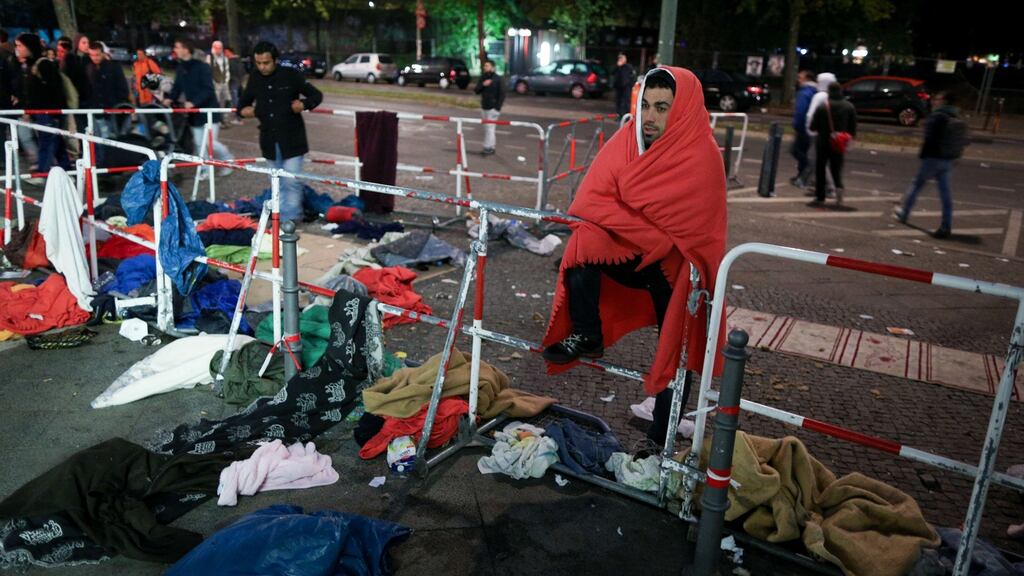 A migrant waits on Wednesday in Berlin in the premises of the State Office for Health and Welfare for registration and allocation of a shelter. Photograph: Getty Images
