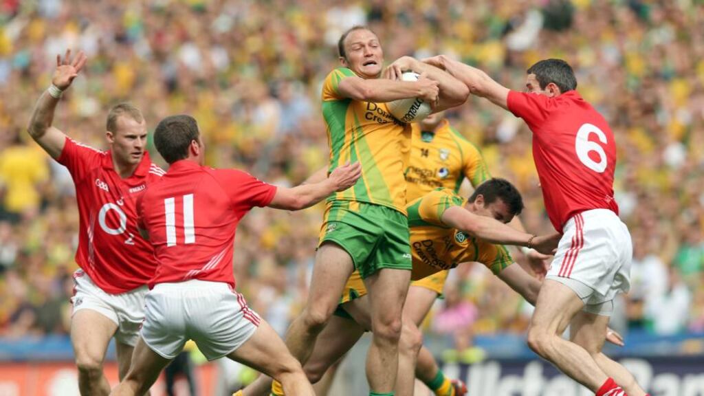 Donegal’s Colm McFadden holds off Cork defenders during the All-Ireland semi-final in 2012. The meetings between the sides have been important staging posts in their respective fortunes over the last six years. Photograph: Donall Farmer/INPHO