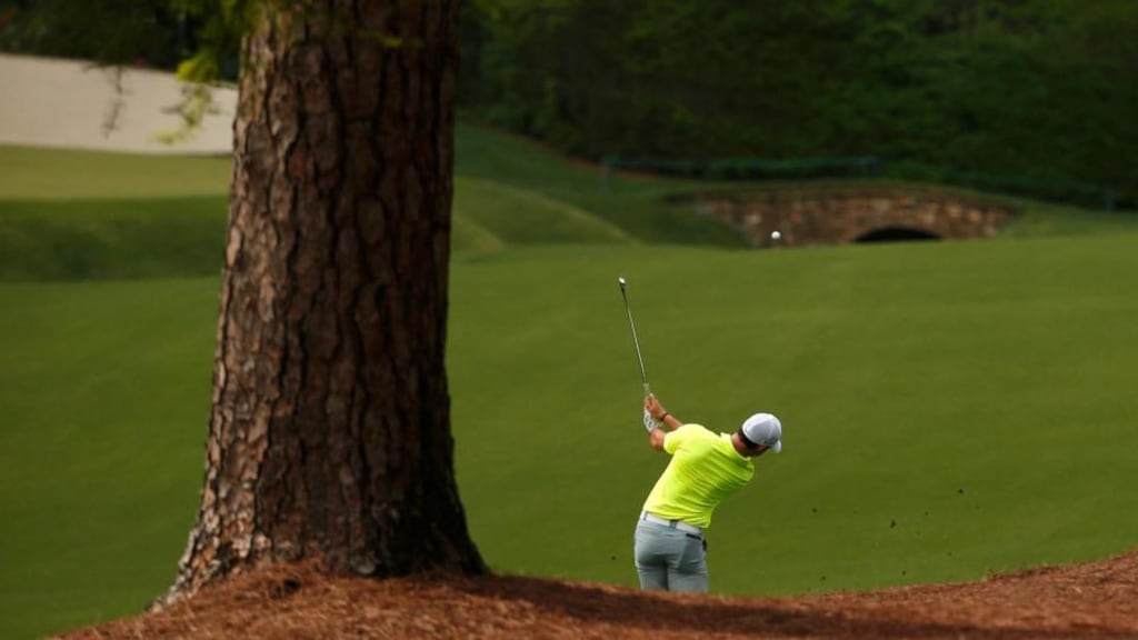 Rory McIlroy  hits his approach shot to the 13th green during a practice round at Augusta National. Photograph:   Phil Noble/Reuters
