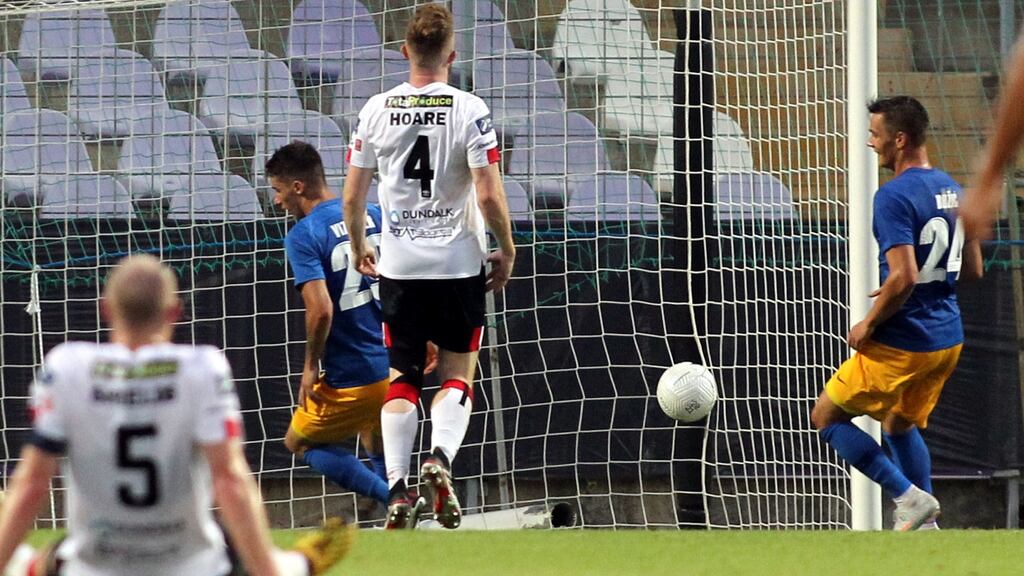 NK Celje score as Sean Hoare of Dundalk looks on. Photograph: Inpho