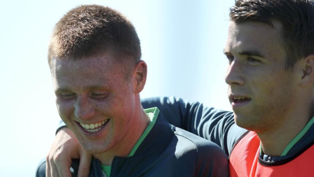 A happy James McCarthy with his new Everton team-mate Seamus Coleman at the Republic of Ireland training session in Malahide yesterday. Photograph: Inpho.