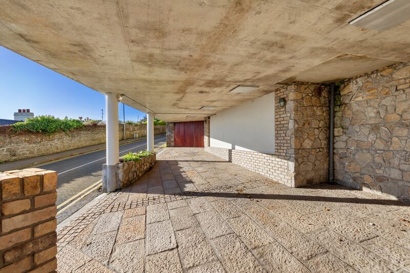 Covered car port has space for two cars