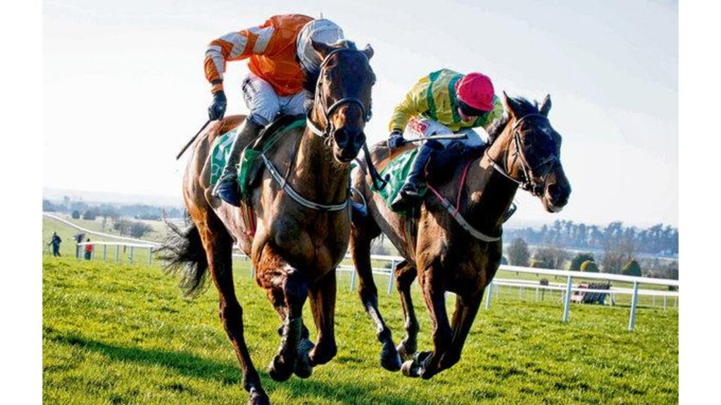 Andrew Lynch on Buckers Bridge (right) pulls clear of Ruby Walsh on Twinlight to win the Flyingbolt Novice Steeplechase at Nava, Co Meat, yesterday. photograph: inpho